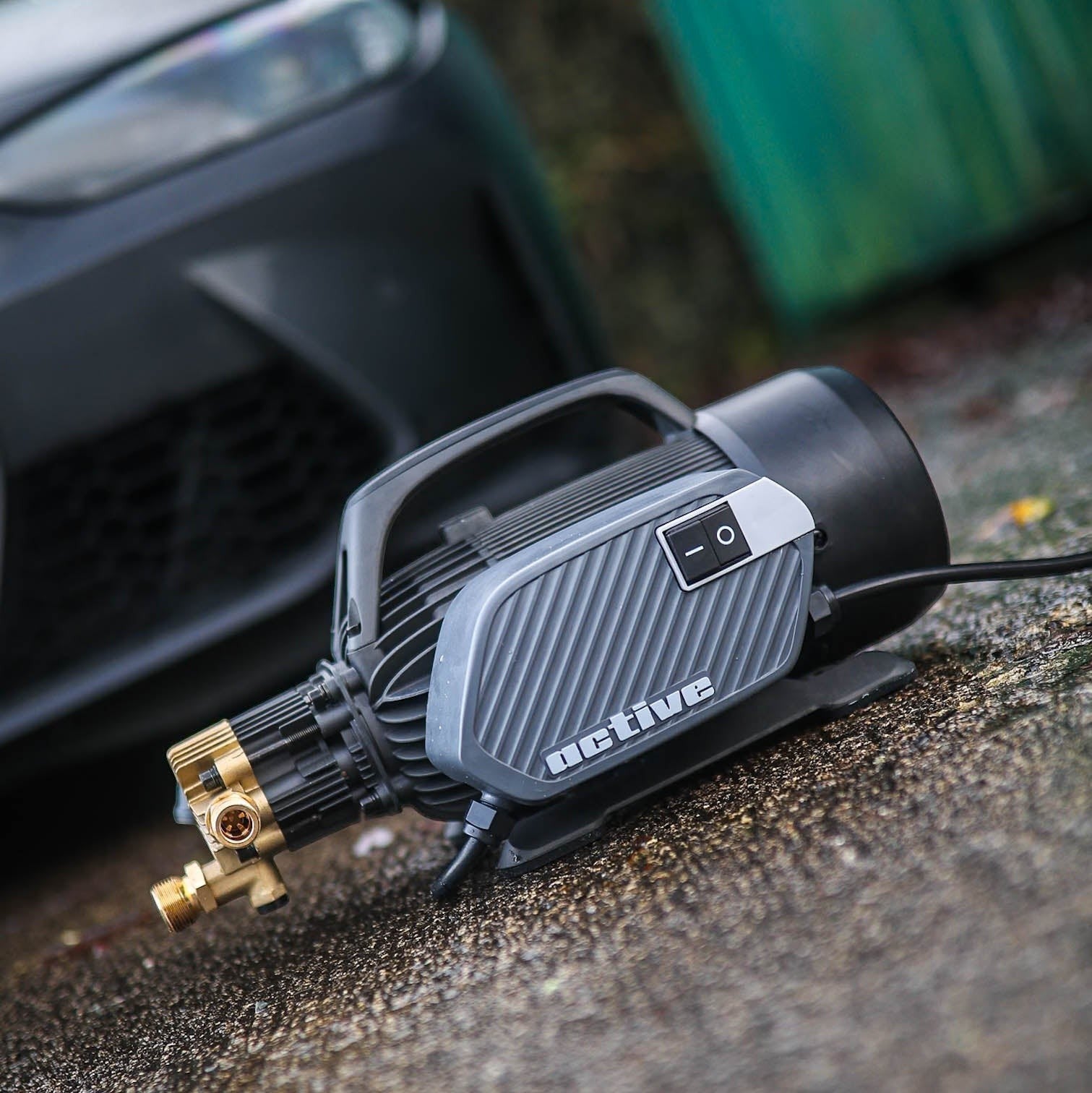 Polished Bliss Active 2.3 electric pressure washer in grey and black, designed for vehicle detailing, with a brass fitting.