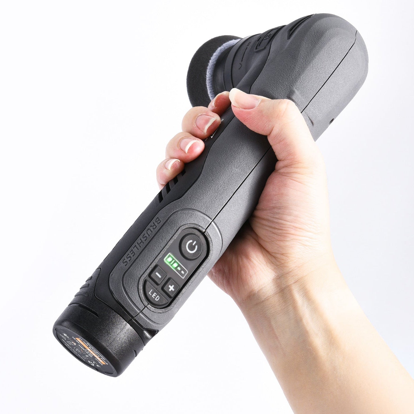 Hand holding a ShineMate EB210 Cordless Polisher with attachments on a white background with control buttons on a white background