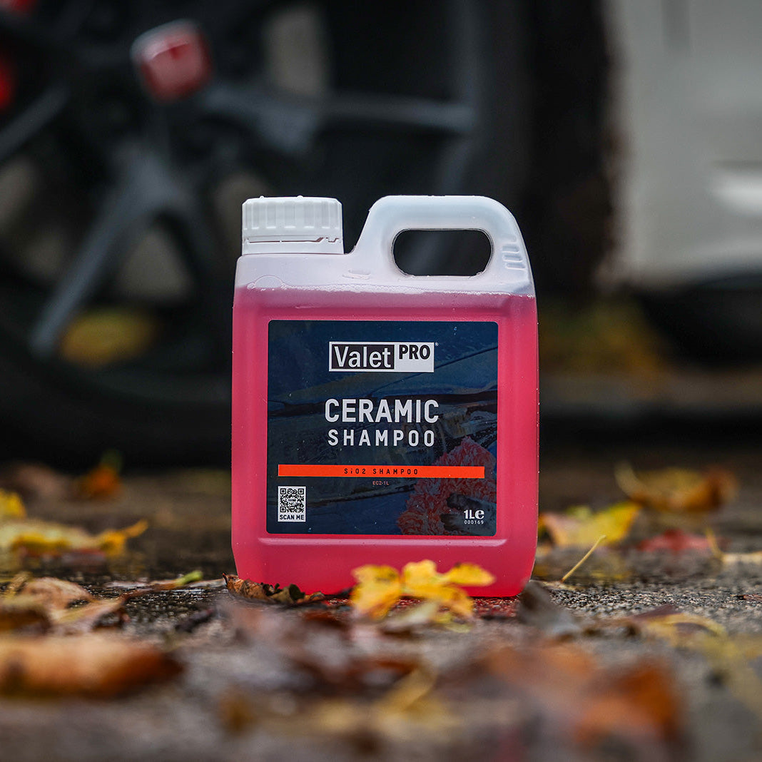 Valet Pro ceramic shampoo bottle on a car ground with blurred vehicle background