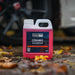 Valet Pro ceramic shampoo bottle on a car ground with blurred vehicle background